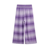 The Tessa Wide Leg Ombre Ribbed Knit Pants by Mabel and Honey feature a striking purple ombre tie-dye pattern.
