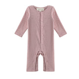 The Mabel + Honey Margret Romper is a long-sleeve, solid heathered pink baby girl romper featuring flower-shaped buttons down the front and along the straight legs, displayed on a white background.