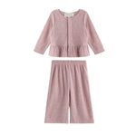 Experience effortless style with the Margret Two Piece Set from Mabel + Honey, featuring a solid long sleeve peplum top with button-up detailing and matching wide leg pants—both crafted from soft fabric for comfortable all-day wear.