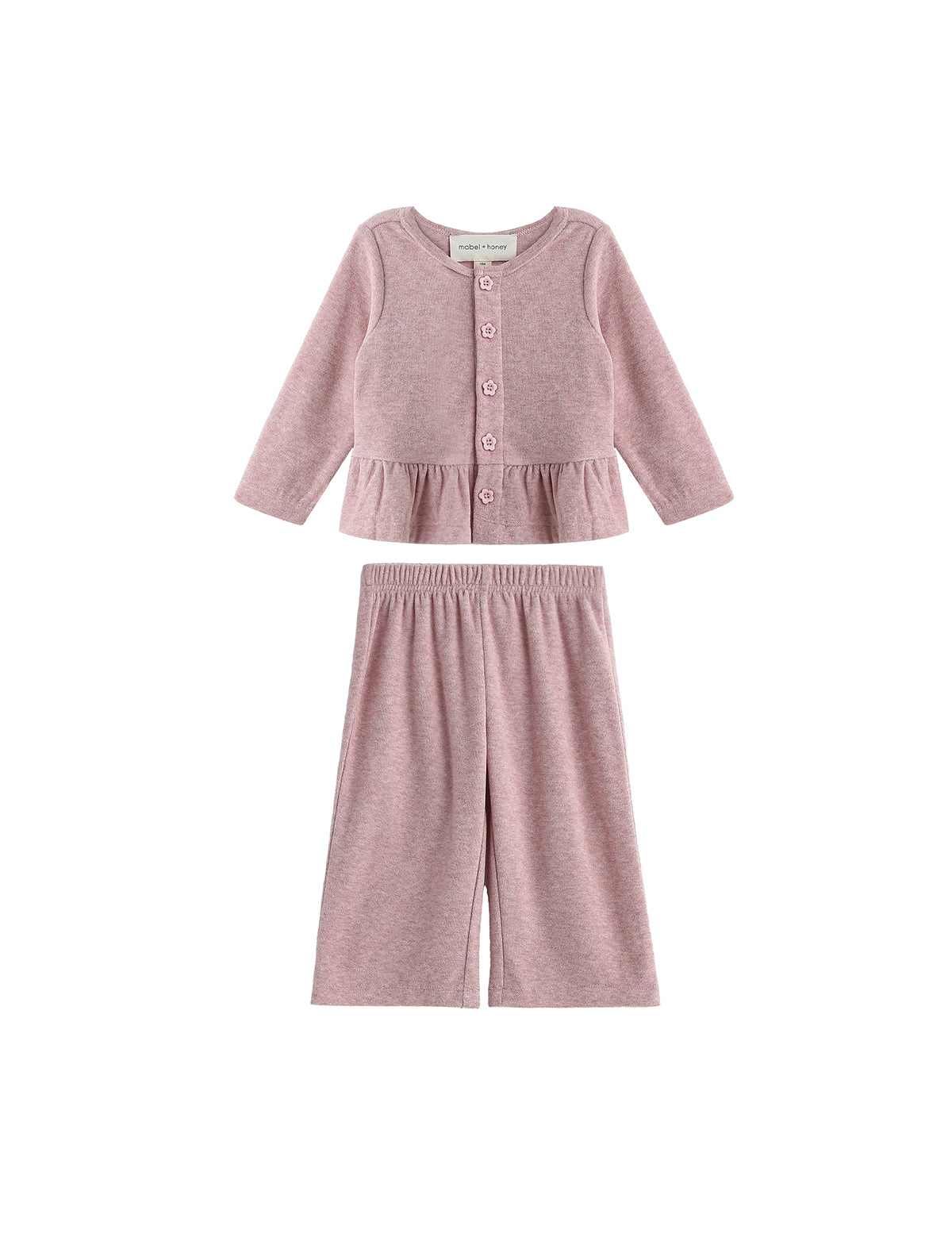 Experience effortless style with the Margret Two Piece Set from Mabel + Honey, featuring a solid long sleeve peplum top with button-up detailing and matching wide leg pants—both crafted from soft fabric for comfortable all-day wear.