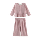 Experience effortless style with the Margret Two Piece Set from Mabel + Honey, featuring a solid long sleeve peplum top with button-up detailing and matching wide leg pants—both crafted from soft fabric for comfortable all-day wear.