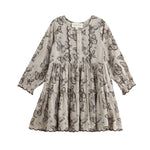 Introducing the Miss Maple Long Sleeve Butterfly Print Scalloped Trim Tiered Dress by Mabel and Honey. This dress showcases black butterfly motifs on a light beige backdrop, crafted from lightweight cotton. It features a tiered skirt, buttoned neckline, and delicate scalloped trim accenting the bodice, sleeves, and hem.