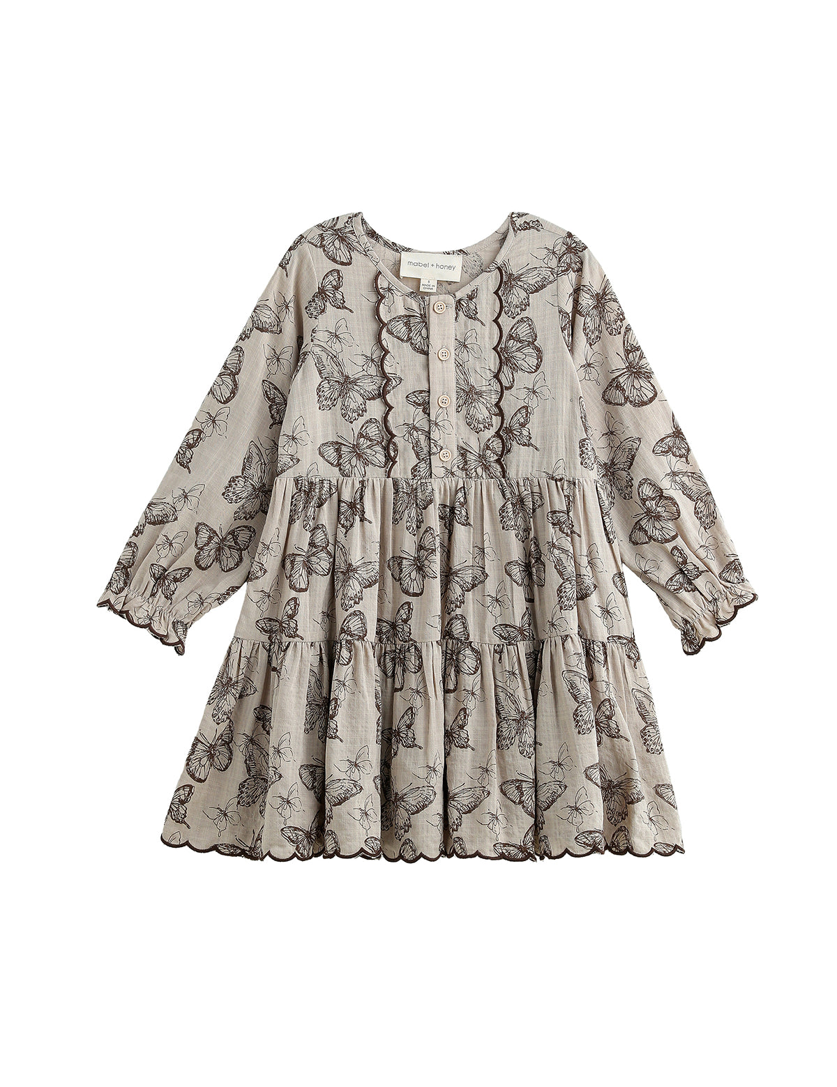 Introducing the Miss Maple Long Sleeve Butterfly Print Scalloped Trim Tiered Dress by Mabel and Honey. This dress showcases black butterfly motifs on a light beige backdrop, crafted from lightweight cotton. It features a tiered skirt, buttoned neckline, and delicate scalloped trim accenting the bodice, sleeves, and hem.