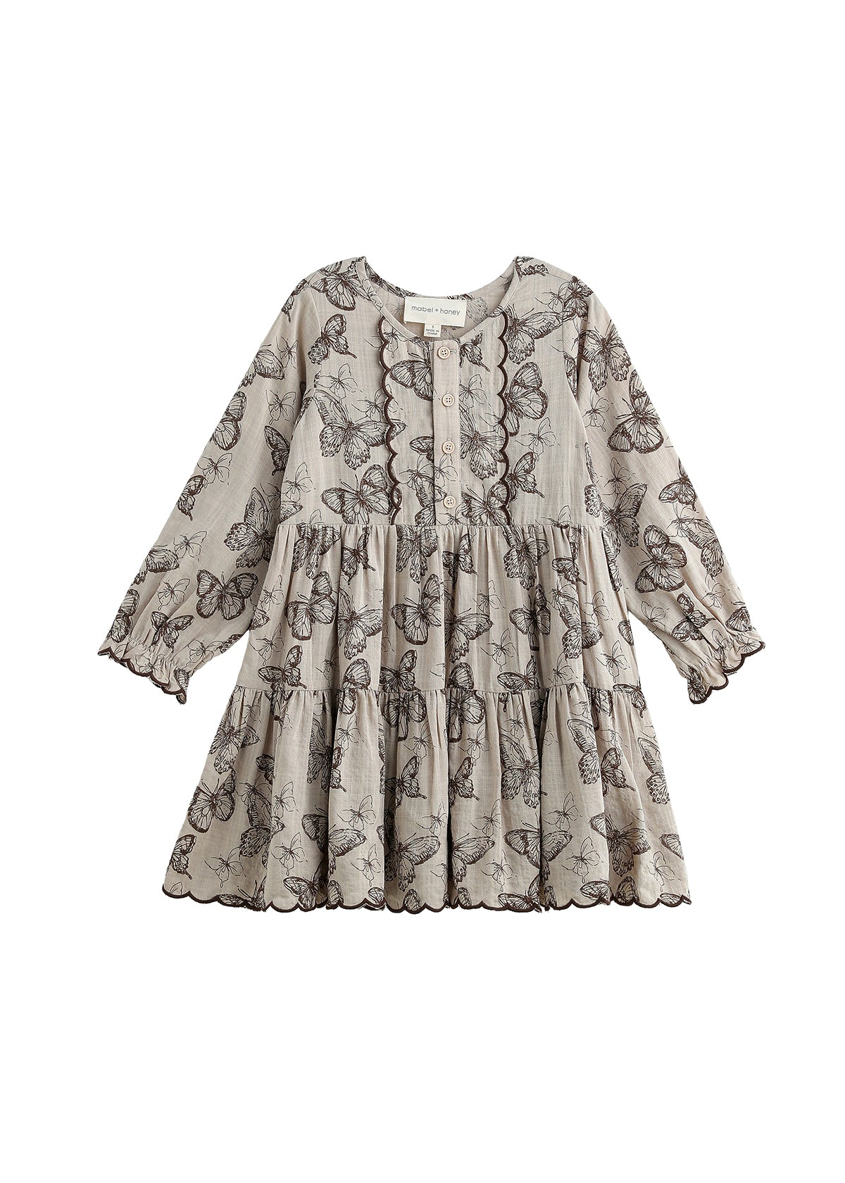 Introducing the Miss Maple Long Sleeve Butterfly Print Scalloped Trim Tiered Dress by Mabel and Honey. This dress showcases black butterfly motifs on a light beige backdrop, crafted from lightweight cotton. It features a tiered skirt, buttoned neckline, and delicate scalloped trim accenting the bodice, sleeves, and hem.