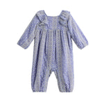 The Mabel + Honey Lavender Lane Romper Long Sleeve Print Ruffle Collar Bubble Romper showcases delicate white embroidered patterns, ruffle details on the shoulders, and gathered cuffs at the wrists and ankles, creating a charming bubble-shaped silhouette that ensures both comfort and style for your little one.
