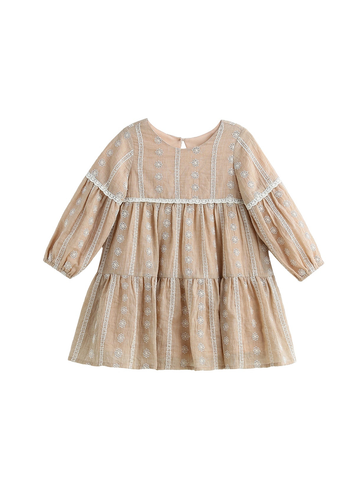 The Patricia Long Sleeve Floral Embroidered Lace Trim Tiered Dress by Mabel and Honey is a light brown children’s dress featuring delicate white floral embroidery, lace trim, and a tiered skirt. Crafted from lightweight cotton, it offers a loose, flowy fit with a round neckline for all-day comfort and charming style.