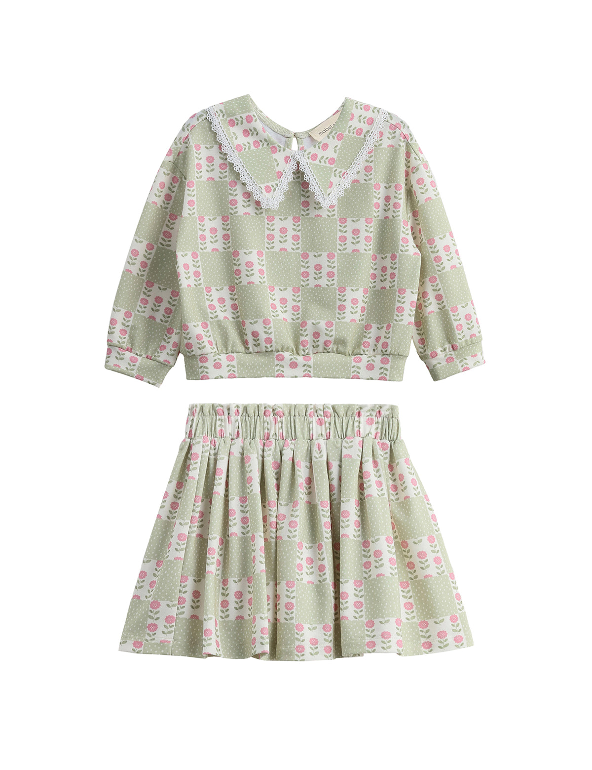 Introducing the Olive Two Piece Set by Mabel + Honey—a charming children’s outfit featuring a long-sleeve top with an elegant floral lace collar and a coordinating skirt. Both pieces showcase a stylish sage green hue adorned with delicate floral patterns, offering an adorable and refined option for everyday wear that stands out from typical checkered or novelty-print sets.