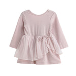 The Emma Dress Long Sleeve Solid Tiered Tulle Skirt Dress by Mabel + Honey features a light pink hue, a textured bodice, and a layered tulle skirt that’s perfect for twirling. Designed with a round neckline and a tied sash at the waist for added detail, this dress coordinates beautifully as part of matching sibling outfits.