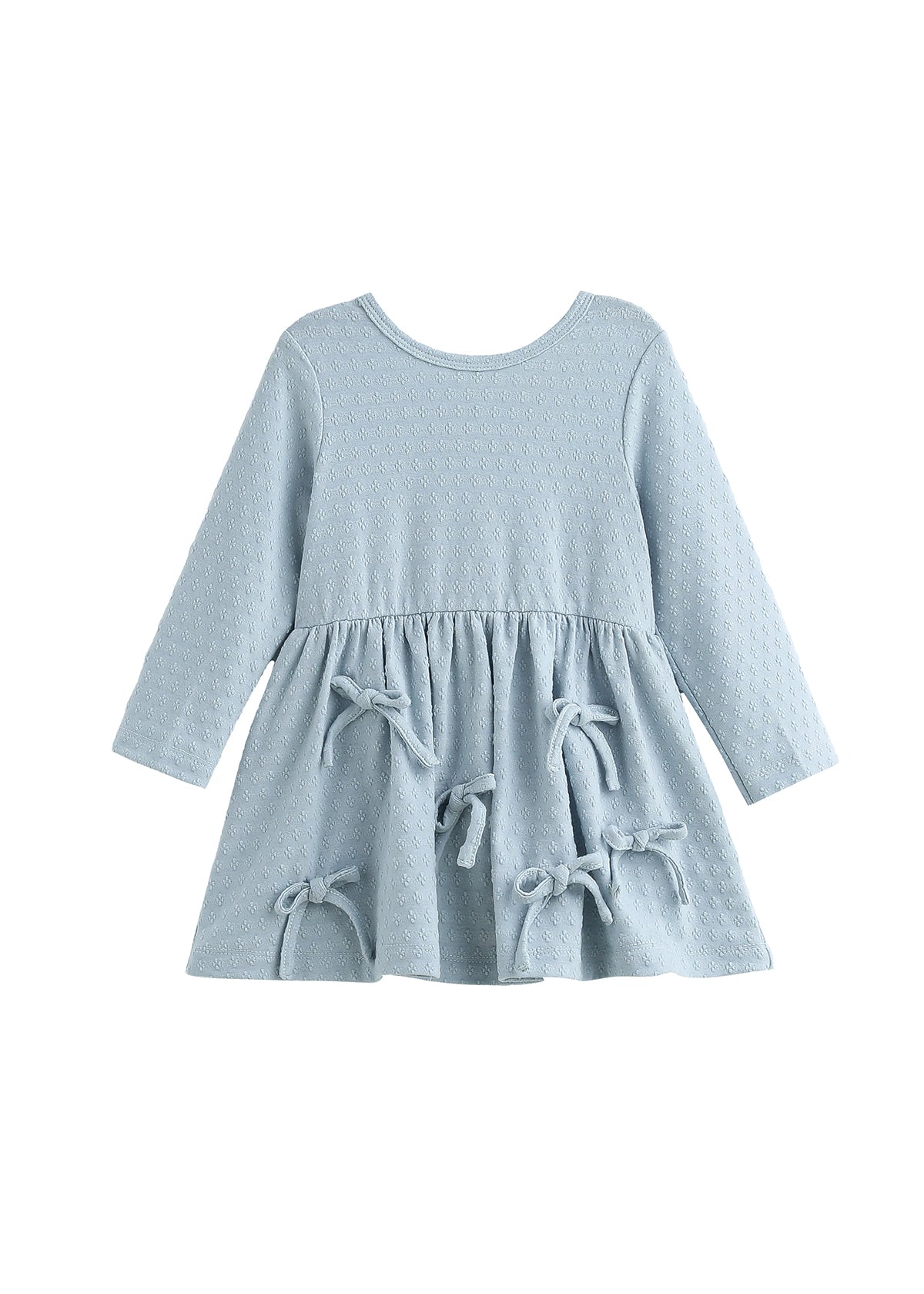 The Eva Dress Long Sleeve Textured A Line Bow Trim Dress by Mabel + Honey is a dusty blue cotton-blend girls’ dress featuring a textured knit pattern, long sleeves, a round neckline, and a flared skirt accented with three decorative bows on the front.