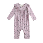 The Mabel + Honey Victoria Romper Long Sleeve Floral Print Ruffle Shoulder Straight Leg Romper features delicate ruffle details on the shoulders and a charming small floral print throughout. Perfect for sibling matching outfits!.