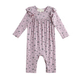 The Mabel + Honey Victoria Romper Long Sleeve Floral Print Ruffle Shoulder Straight Leg Romper features delicate ruffle details on the shoulders and a charming small floral print throughout. Perfect for sibling matching outfits!.