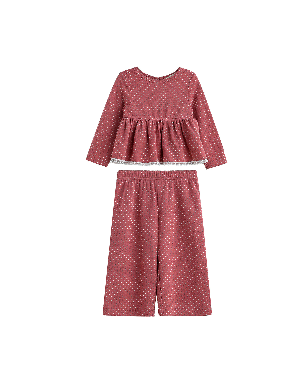 The Maribelle Two Piece Set by Mabel + Honey features a long sleeve polka dot peplum top and matching wide-leg pants in a dusty rose hue with small white spots, creating a playful yet chic look for girls.
