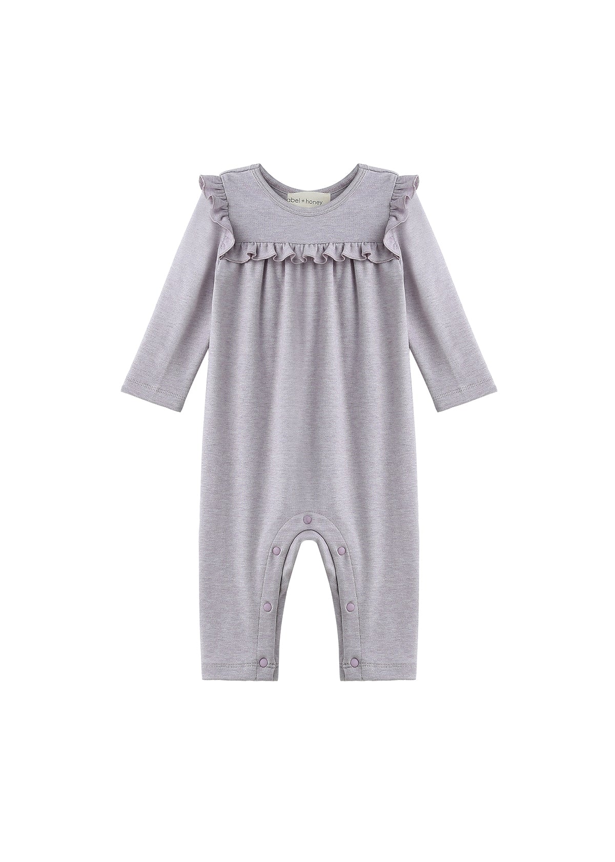 Dress your little one in the Mabel + Honey Maggie Romper Long Sleeve Solid Ruffle Trim Straight Leg Romper. This heathered lavender romper for baby girls features charming ruffle details on the chest and shoulders, and convenient snap buttons along the legs for easy diaper changes. Crafted from soft, comfortable fabric, it’s perfect for your baby’s everyday wear.