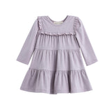 The Mabel + Honey Maggie Dress Long Sleeve Solid Ruffle Tiered Knit Dress in heathered lavender features a round neckline, charming ruffle details across the chest and skirt, and a playful tiered silhouette—perfect for coordinating sibling outfits.
