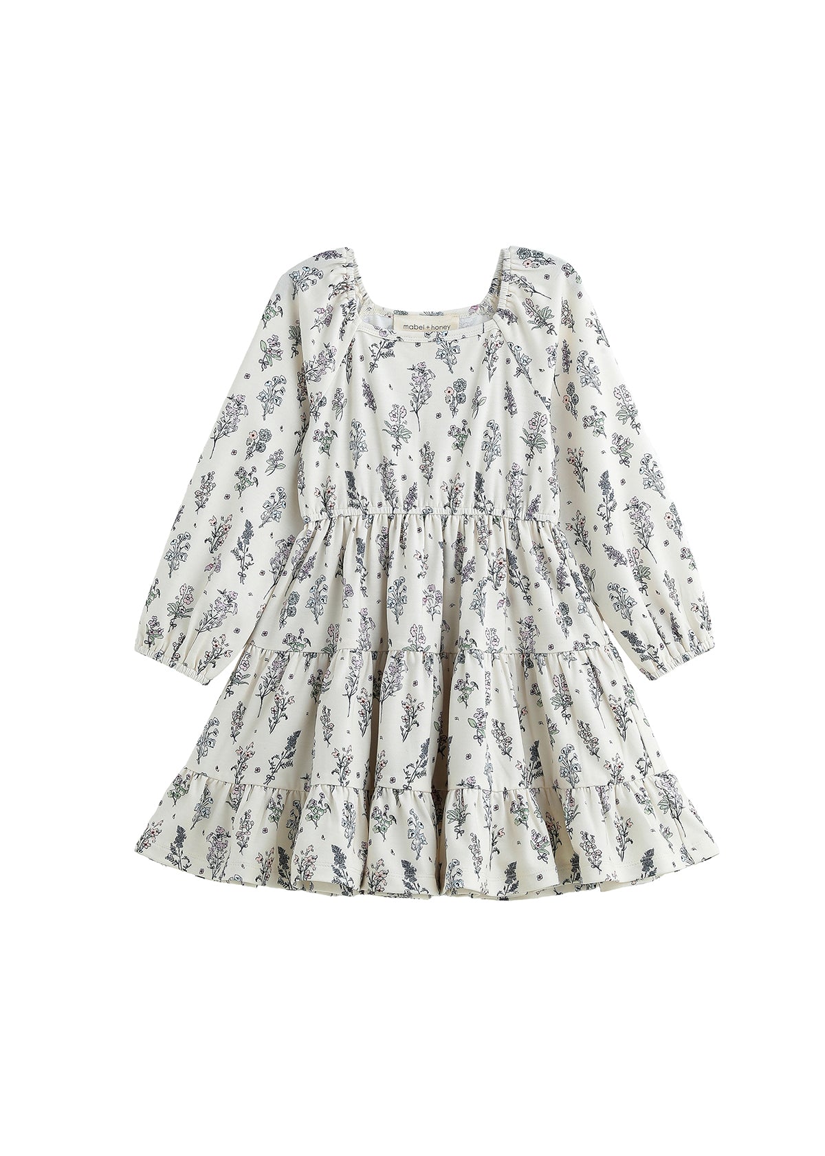 The Gracie Dress Long Sleeve Floral Print Tiered A Line Dress by Mabel + Honey features a white, long-sleeve design with blue wildflower prints, a tiered skirt, square neckline, and a flowy A-line silhouette for girls.