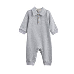 The Beckett and Bear Jacob Long Sleeve Solid Collared Ribbed Trim Romper is crafted from a soft cotton-blend knit in heathered gray, featuring long sleeves, a charming collar, and a button-up chest. Convenient snap closures line the legs for easy changes. Shown on a white background.