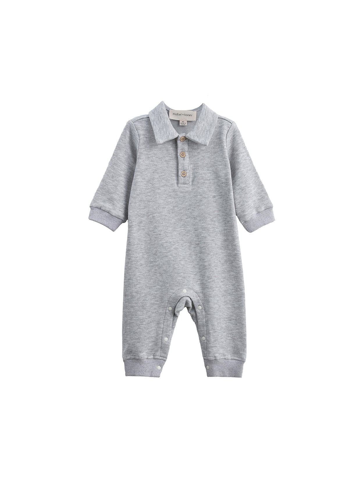 The Beckett and Bear Jacob Long Sleeve Solid Collared Ribbed Trim Romper is crafted from a soft cotton-blend knit in heathered gray, featuring long sleeves, a charming collar, and a button-up chest. Convenient snap closures line the legs for easy changes. Shown on a white background.