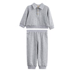 The Jacob Two Piece Set from Mabel + Honey features a long sleeve solid polo top with buttons and matching heather grey joggers, both designed for comfort and casual style. This soft, light gray set includes an elastic waistband and cuffs for an easy fit, making it perfect for everyday wear.