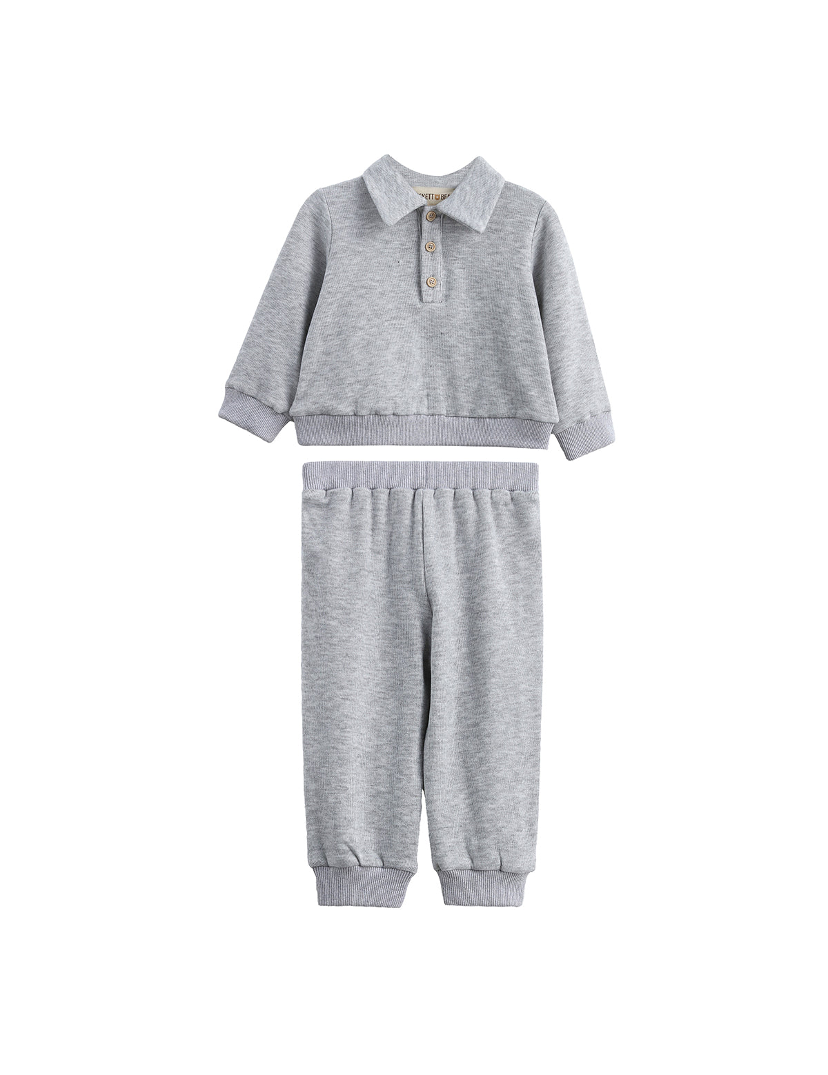 The Jacob Two Piece Set from Mabel + Honey features a long sleeve solid polo top with buttons and matching heather grey joggers, both designed for comfort and casual style. This soft, light gray set includes an elastic waistband and cuffs for an easy fit, making it perfect for everyday wear.
