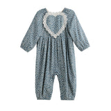 The Mabel + Honey Dolly Romper Long Sleeve Floral Lace Heart Bubble Romper features a charming blue design with white polka dots, long sleeves, and a large heart-shaped lace detail on the chest. With gathered fabric at the neck and ankles, this adorable romper is perfect for your baby girl’s fall wardrobe.