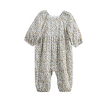 Introducing the Wildflower Dream Romper Long Sleeve Floral Bubble Romper by Mabel + Honey—a charming, ditsy floral romper designed for both comfort and style. This baby romper showcases long sleeves with elastic cuffs, a light beige background accented by a delicate small floral print in soft colors, and gathered details at the waist with bubble-shaped leg openings. Its loose fit ensures your little one stays cozy and comfortable all day long.