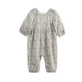 Introducing the Wildflower Dream Romper Long Sleeve Floral Bubble Romper by Mabel + Honey—a charming, ditsy floral romper designed for both comfort and style. This baby romper showcases long sleeves with elastic cuffs, a light beige background accented by a delicate small floral print in soft colors, and gathered details at the waist with bubble-shaped leg openings. Its loose fit ensures your little one stays cozy and comfortable all day long.