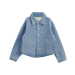 The Mabel + Honey Jacket Long Sleeve Print Rhinestone Bow Detail Cropped Denim Jacket features a light blue wash, classic collar, long sleeves, silver snap buttons, and sparkling rhinestone pink bows and dots embroidered on the front. The jacket is displayed laid flat on a white background.