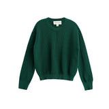 Showcased on a white background, the Mabel + Honey Evergreen Sweater Long Sleeve Solid Ribbed Crewneck Sweater features a plain dark green color, ribbed-knit texture, cozy long sleeves, and a classic crew neckline—making it a timeless wardrobe staple.