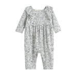 Dress your little one in the Doggie Doodles Romper Long Sleeve Print Ruffle Collar Straight Leg Romper by Mabel + Honey. This light gray romper for babies features charming ruffled shoulder details and a playful black dog print pattern with outlined puppies. Crafted from soft, comfortable fabric, this stylish outfit combines the elegance of a ruffled trim with a practical straight leg design—perfect for infants on the go.