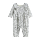 Dress your little one in the Doggie Doodles Romper Long Sleeve Print Ruffle Collar Straight Leg Romper by Mabel + Honey. This light gray romper for babies features charming ruffled shoulder details and a playful black dog print pattern with outlined puppies. Crafted from soft, comfortable fabric, this stylish outfit combines the elegance of a ruffled trim with a practical straight leg design—perfect for infants on the go.