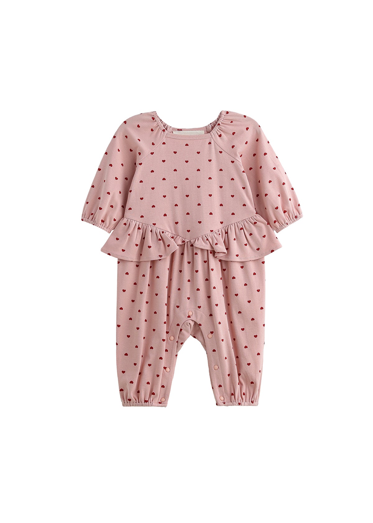 Dress your little one in the Mabel + Honey Love me Lots Romper Long Sleeve Heart Print Ruffle Waist Romper—featuring a playful pink design with red heart prints, ruffle details at the waist, and elastic cuffs at the wrists and ankles. This adorable piece is perfect for girls as a Valentine’s Day outfit!.