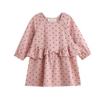 The Love me Lots Dress Long Sleeve Heart Print Ruffle Waist Dress by Mabel + Honey features a charming pink design with a ruffled waist and adorable small red heart pattern, making it the perfect choice for your little one or as part of matching sibling outfits for girls’ Valentine’s dress celebrations. Displayed on a white background, this sweet dress adds extra love to any occasion.