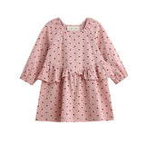 The Love me Lots Dress Long Sleeve Heart Print Ruffle Waist Dress by Mabel + Honey features a charming pink design with a ruffled waist and adorable small red heart pattern, making it the perfect choice for your little one or as part of matching sibling outfits for girls’ Valentine’s dress celebrations. Displayed on a white background, this sweet dress adds extra love to any occasion.