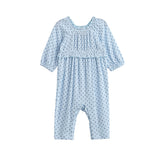 Dress your little one in the Luna Bella Romper Long Sleeve Star Print Ruffle Trim Romper by Mabel + Honey—a light blue romper featuring long sleeves, delicate dark blue star prints, ruffled chest detail, and elastic cuffs at the sleeves and ankles.