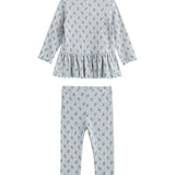 The Mabel + Honey Petite Petal Two Piece Set features a long-sleeved floral peplum top and matching ribbed knit leggings, both in light blue with a delicate red floral print and ruffled trim. This charming set is displayed on a white background.