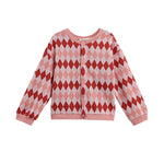 The Jessica Long Sleeve Argyle Print Button Front Sweater by Mabel and Honey features a pink and red argyle pattern with long sleeves and front buttons, displayed on a white background.