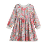 The Mabel + Honey Eliza Dress is a charming long sleeve girls’ dress featuring a beautiful blend of pink, white, and gray floral patterns. This knee-length dress is designed with a gathered skirt and finished with white ribbed cuffs and neckline for added comfort and style.