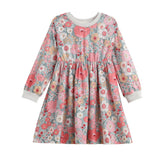 The Mabel + Honey Eliza Dress is a charming long sleeve girls’ dress featuring a beautiful blend of pink, white, and gray floral patterns. This knee-length dress is designed with a gathered skirt and finished with white ribbed cuffs and neckline for added comfort and style.