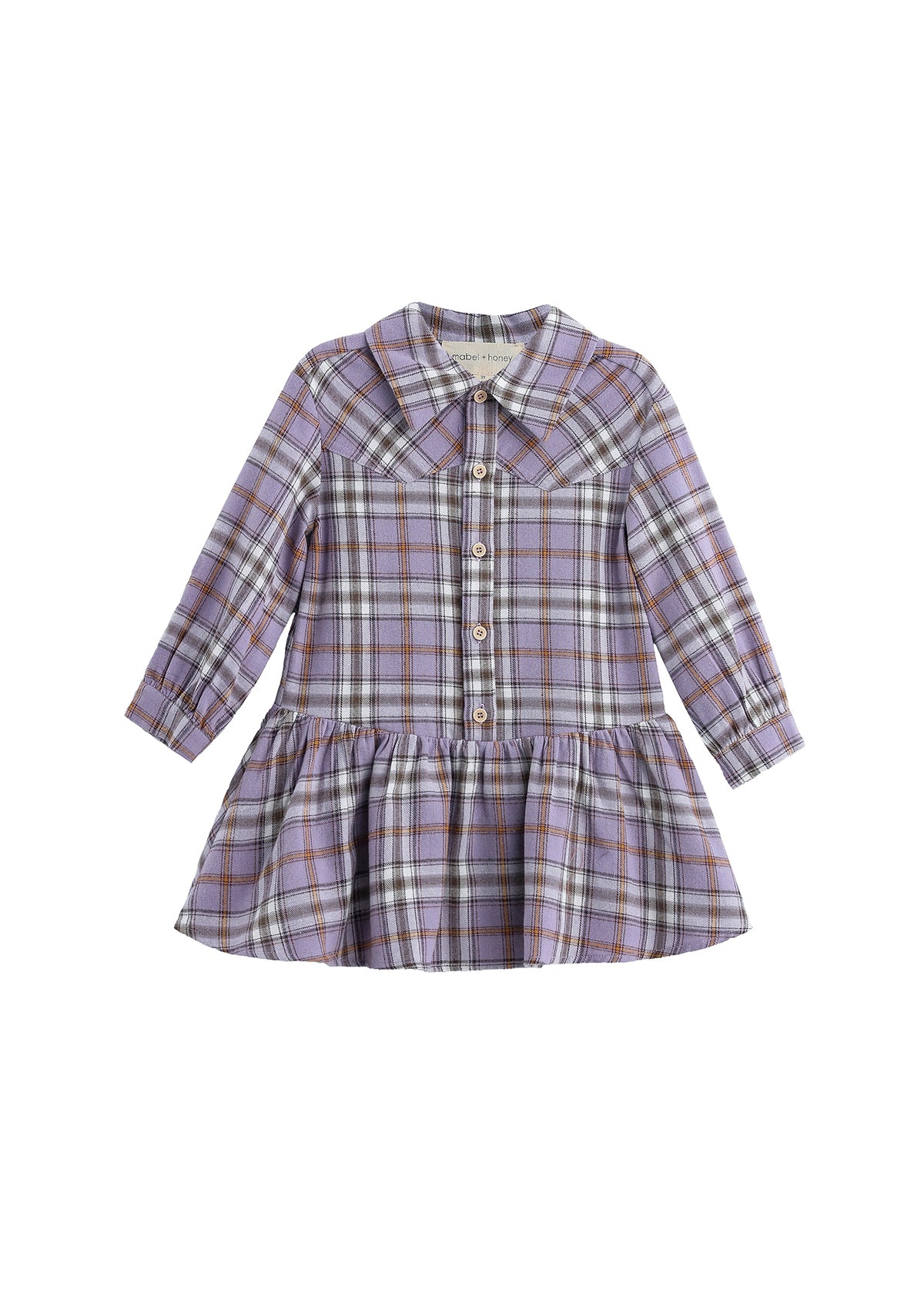 The Mabel and Honey Char Long Sleeve Plaid Collared Drop Waist Dress is a children’s dress made from soft brushed flannel. Featuring a classic plaid pattern in shades of purple, brown, and white, this lavender dress has long sleeves, a collared neckline, white buttons down the front, and a gathered drop waist skirt.