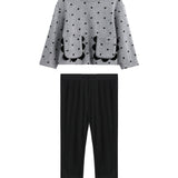 The Mabel + Honey Petal Pockets Two Piece Set features a long sleeve floral top with scalloped pockets and plain black pants, arranged flat on a white background.