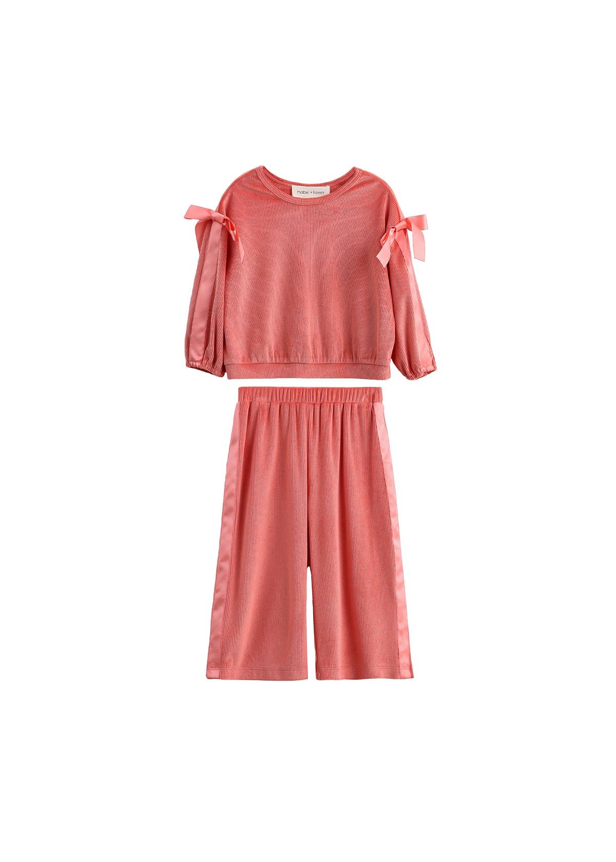 The Poppy Rose Long Sleeve Ribbed Bow Tie Top and Wide Leg Pant Set by Mabel and Honey features bow accents on the shoulders and a comfortable ribbed fabric, presented in a vibrant coral hue. This matching two-piece set includes a long sleeve top and wide-leg pants, both displayed against a white background.