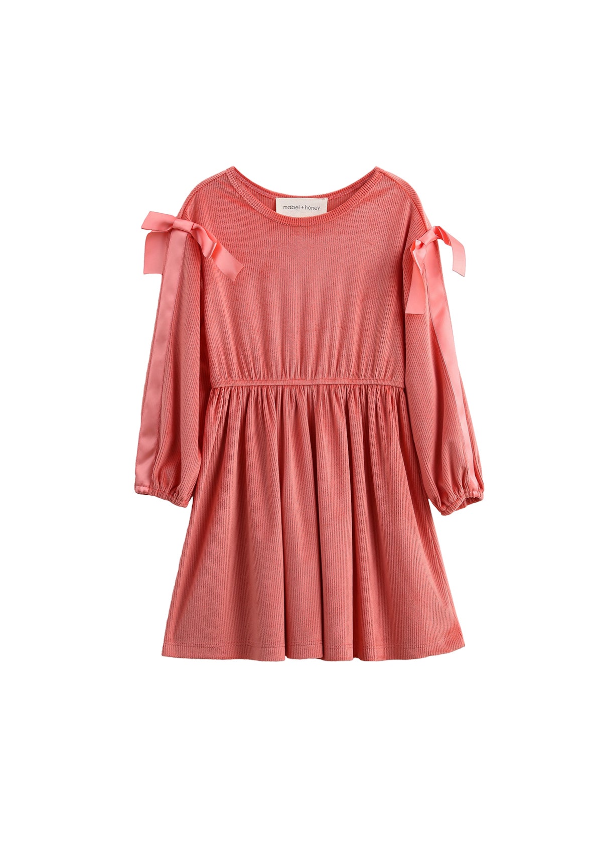The Poppy Rose Long Sleeve Solid Ribbed Bow Tie Shoulder Dress by Mabel and Honey features a pink coral ribbed knit with a gathered waist, round neckline, and slightly puffy bishop sleeves with elasticized cuffs. Satin bows adorn each shoulder for an extra touch of charm.