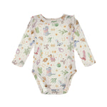 Outfit your little one in charming Western style with the Mabel and Honey Cactus Kisses Bodysuit Long Sleeve Western Print Ruffle Shoulder Bodysuit. This cream bodysuit features long sleeves, adorable ruffle shoulders, and a playful pastel print of cowboy boots, hats, cacti, horseshoes, and sheriff stars—perfect for adding a touch of fun to your baby’s wardrobe.