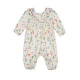 Dress your little one in the Mabel and Honey Cactus Kisses Romper, a long-sleeved bubble romper featuring a ruffle collar and charming western-inspired print with colorful cacti, flowers, animals, and playful objects on a crisp white background.