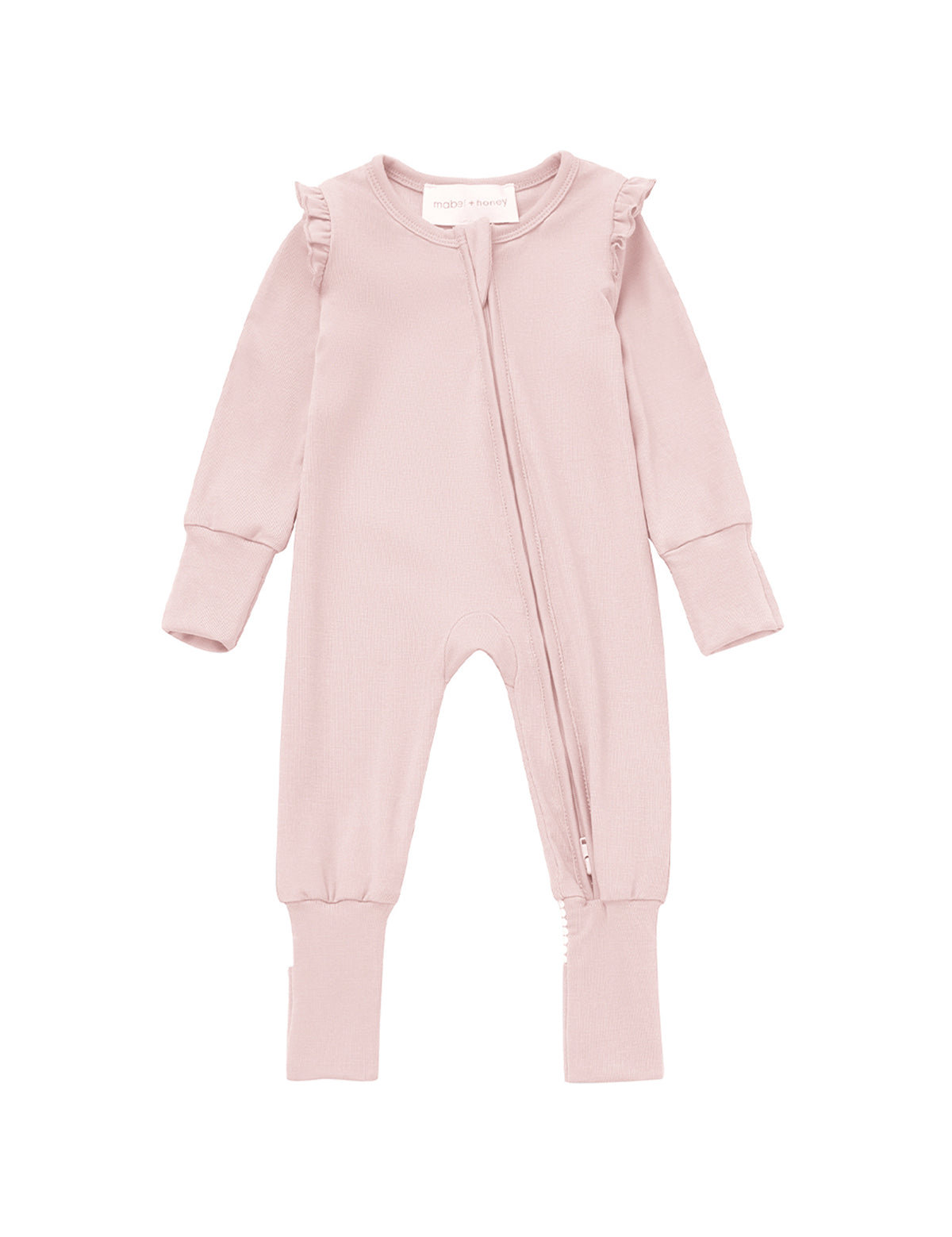 Dress your baby in the Whimsical Wildflower Long Sleeve Ruffle Trim Zip Front Convertible Romper by Mabel and Honey, featuring a light pink blush hue, long sleeves, delicate ruffle details on the shoulders, and a convenient two-way diagonal zipper from neck to left leg. Its ribbed knit fabric provides a soft and cozy feel.