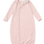 Dress your little one in the Mabel and Honey Whimsical Wildflower Long Sleeve Ruffle Trim Wrap Front Newborn Gown, featuring a soft pink hue, gentle fabric, charming ruffled trim along the front, long sleeves, and an elasticized hem for comfort. A small tag is visible at the neckline, making this gown perfect for infants.