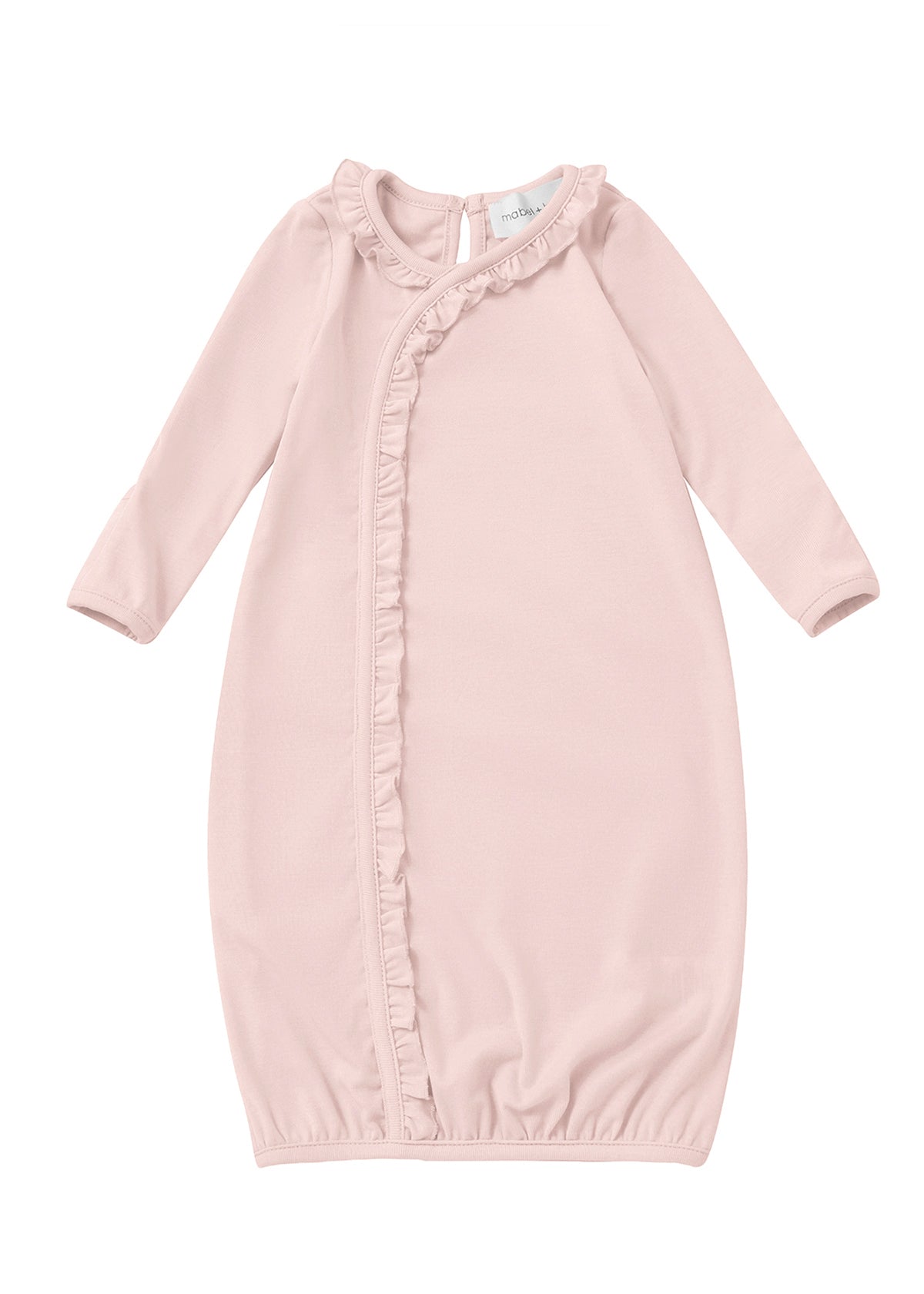 Dress your little one in the Mabel and Honey Whimsical Wildflower Long Sleeve Ruffle Trim Wrap Front Newborn Gown, featuring a soft pink hue, gentle fabric, charming ruffled trim along the front, long sleeves, and an elasticized hem for comfort. A small tag is visible at the neckline, making this gown perfect for infants.