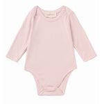 The Mabel and Honey Whimsical Wildflower Long Sleeve Solid Scalloped Trim Snap Bottom Bodysuit is shown on a plain white background, featuring a light pink color, round neckline, long sleeves, scalloped trim details, and convenient snap closures at the bottom. Crafted from soft Tencel knit for gentle comfort.