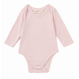 The Mabel and Honey Whimsical Wildflower Long Sleeve Solid Scalloped Trim Snap Bottom Bodysuit is shown on a plain white background, featuring a light pink color, round neckline, long sleeves, scalloped trim details, and convenient snap closures at the bottom. Crafted from soft Tencel knit for gentle comfort.