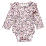 The Mabel and Honey Whimsical Wildflower Bodysuit features long sleeves, a charming floral print, and ruffle shoulders, displayed flat against a white background.